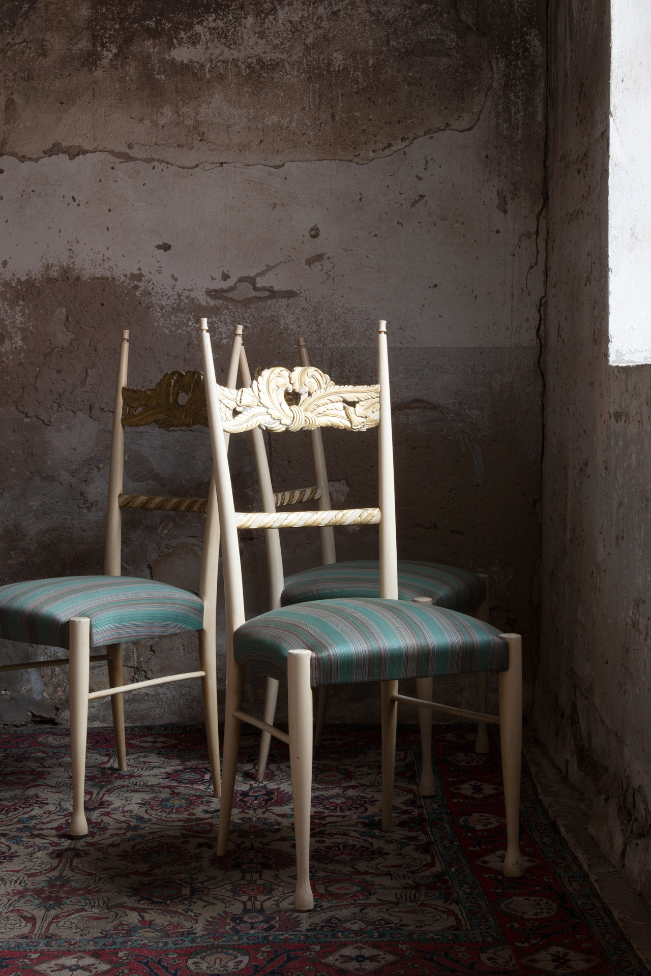 a set of four chairs by Paolo Buffa and Giovanni Gariboldi